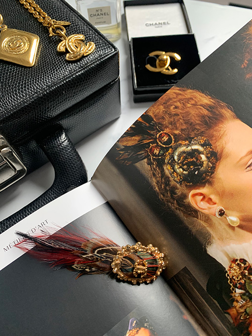 Stacked vintage bracelets shown on woman's arm